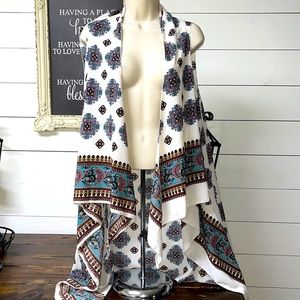 This vest is absolutely beautiful! Made it 100% polyester one size fits most.